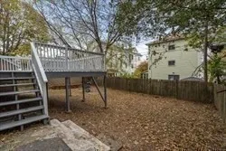 a view of a patio with a table and chairs