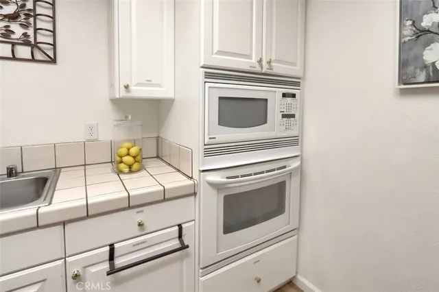 a view of a livingroom with furniture and an entryway