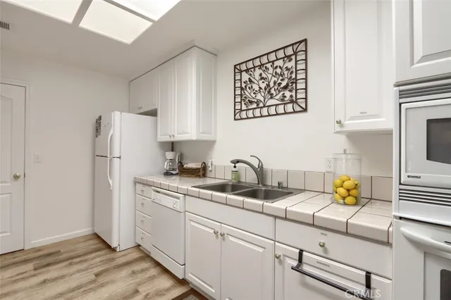 a view of a livingroom with furniture and a window