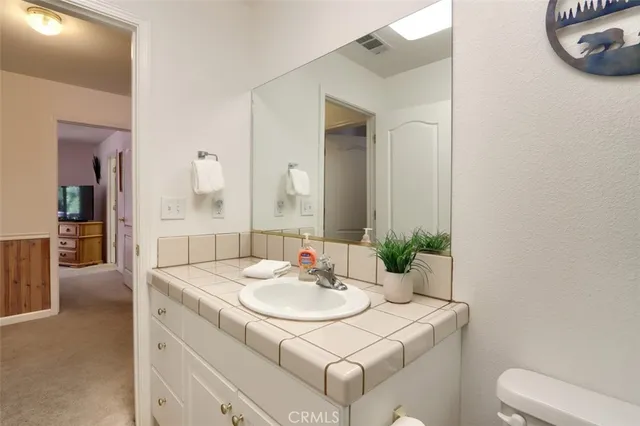 a view of a chair and table in the roof deck