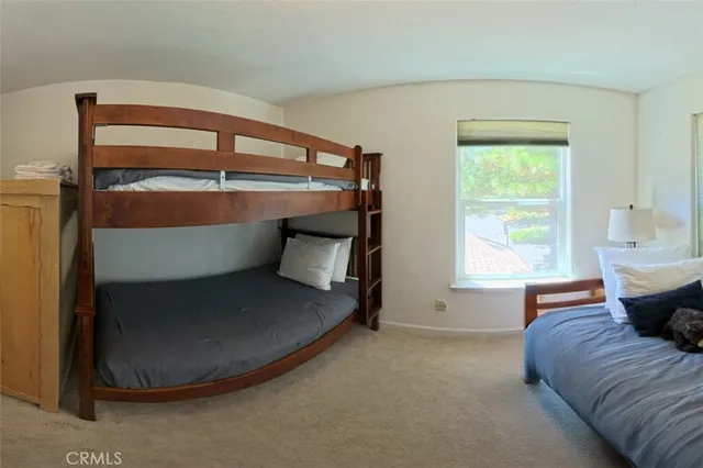 a outdoor sitting area with furniture and wooden floor