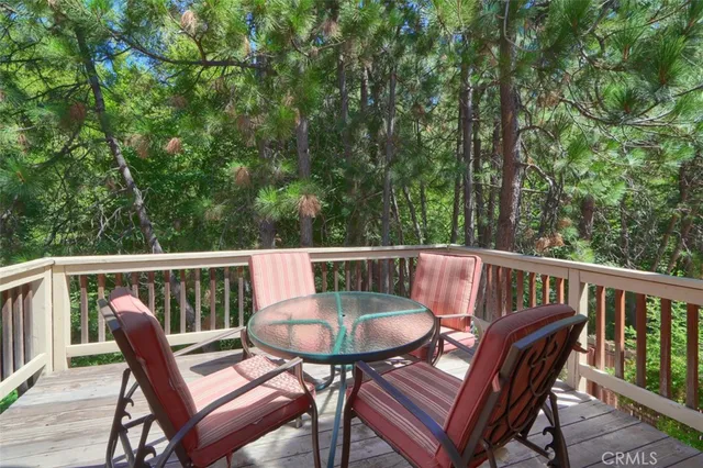 a view of a dining room with furniture and a potted plant