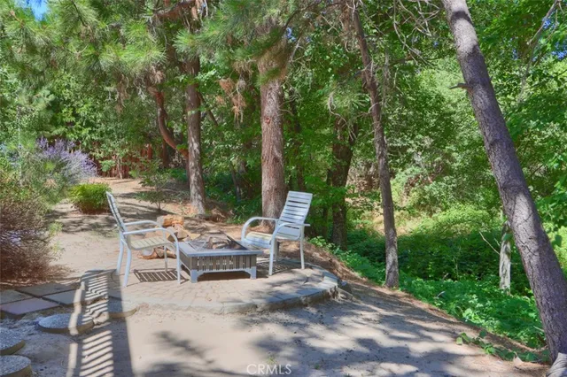 an aerial view of a multi story residential apartment building with a yard and potted plants