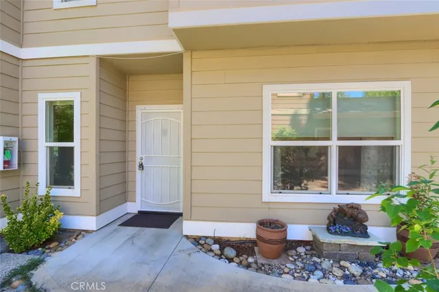 a front view of a house with a outdoor seating