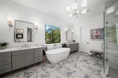 an aerial view of a house with a yard table and chairs