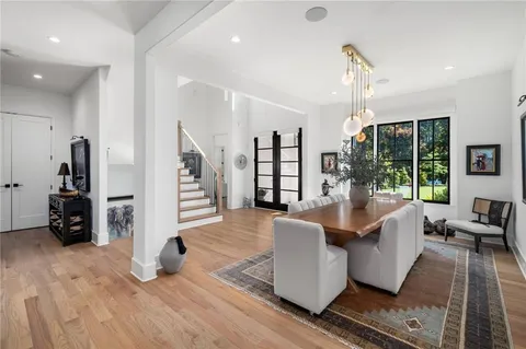 a kitchen with stainless steel appliances granite countertop a stove and a wooden floors