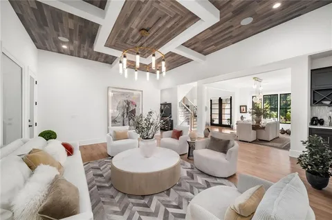 a kitchen with stainless steel appliances granite countertop a sink a stove and a refrigerator