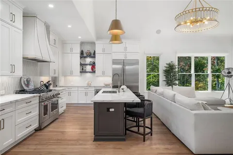 a view of a bathroom with a tub sink and mirror