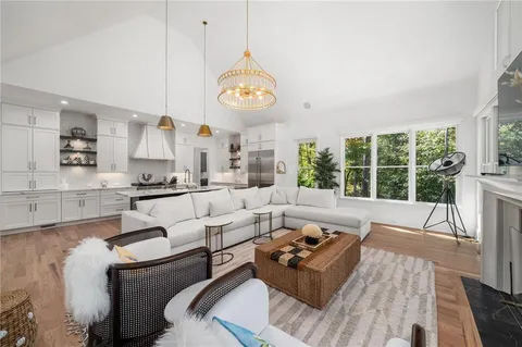 a bed room with a bed and a chair