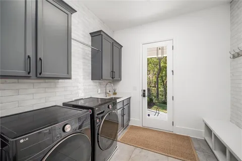 a bathroom with a granite countertop sink a toilet and shower