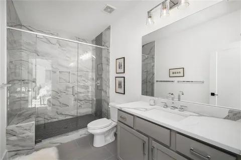 an aerial view of a house with swimming pool and garden