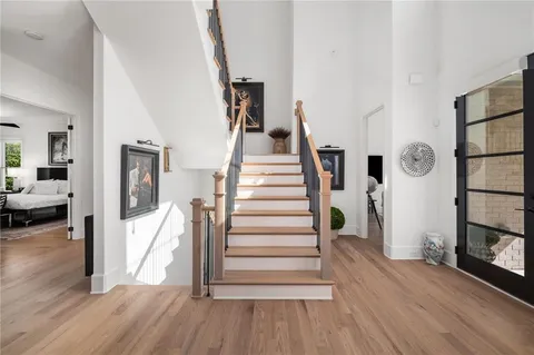 an aerial view of a house with a garden and swimming pool