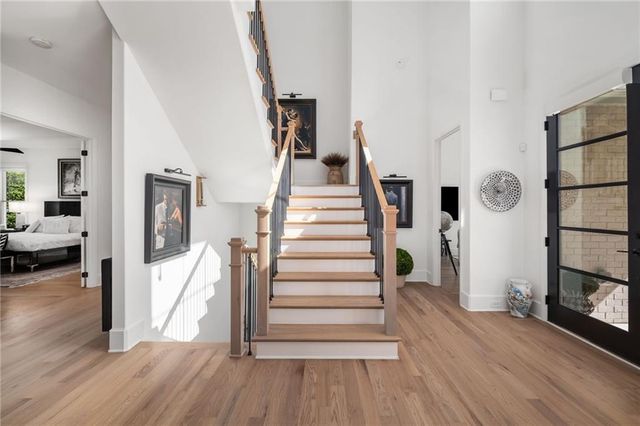 an aerial view of a house with a garden and swimming pool