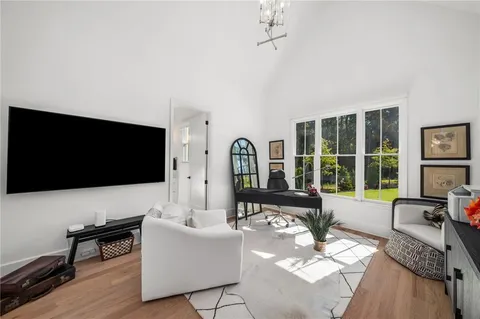 a spacious bathroom with a double vanity sink a mirror and a bathtub