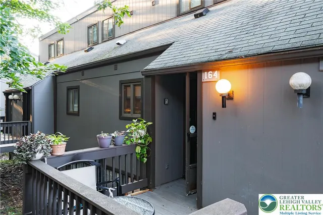 a view of a chair and table in the balcony
