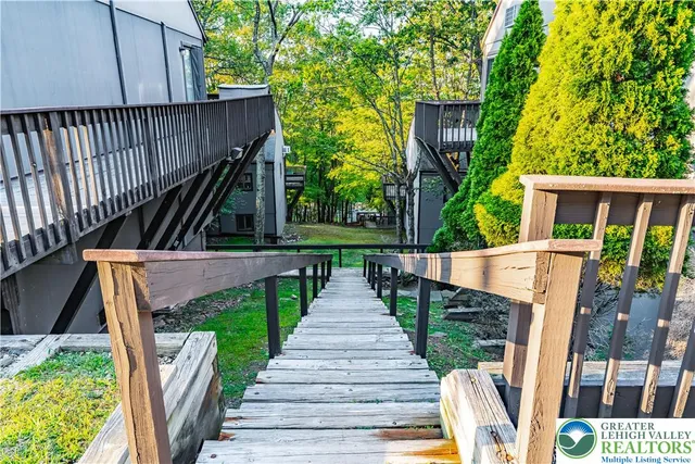 a view of balcony with furniture and umbrella