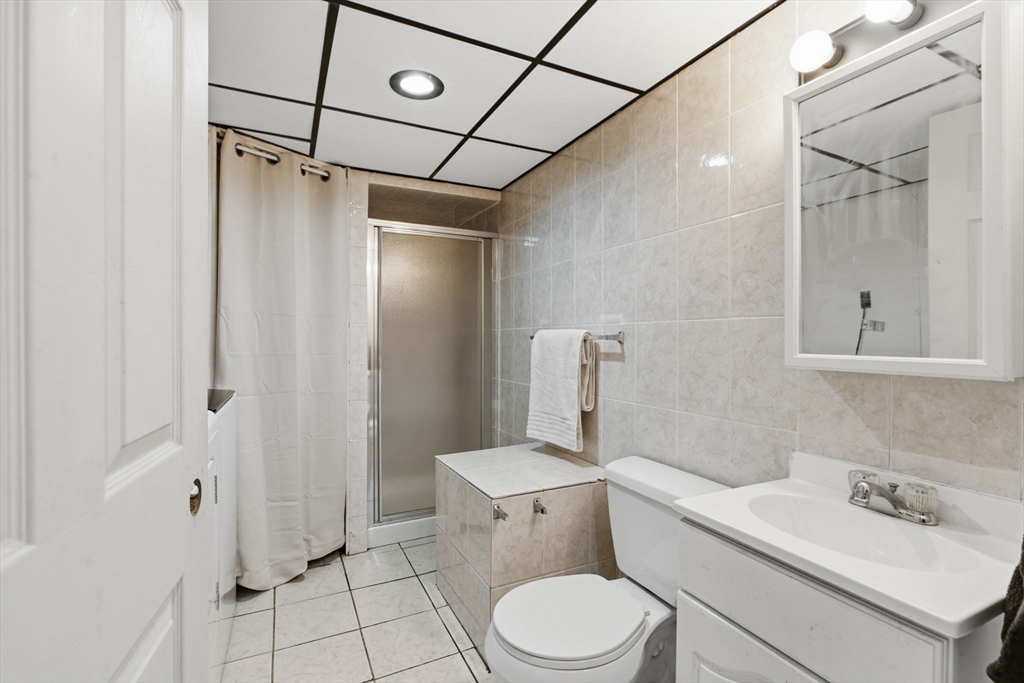 78 Dunstable Road Westford, MA 01886 - Photo 20 of 27 a bathroom with a sink toilet and shower