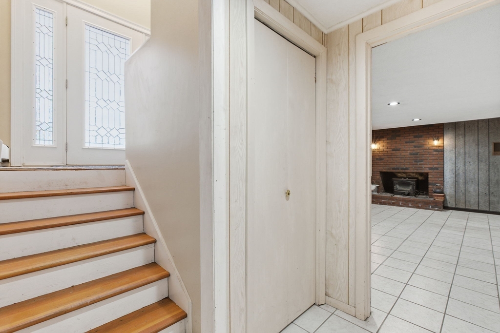 78 Dunstable Road Westford, MA 01886 - Photo 21 of 27 a view of entryway and bedroom with wooden floor