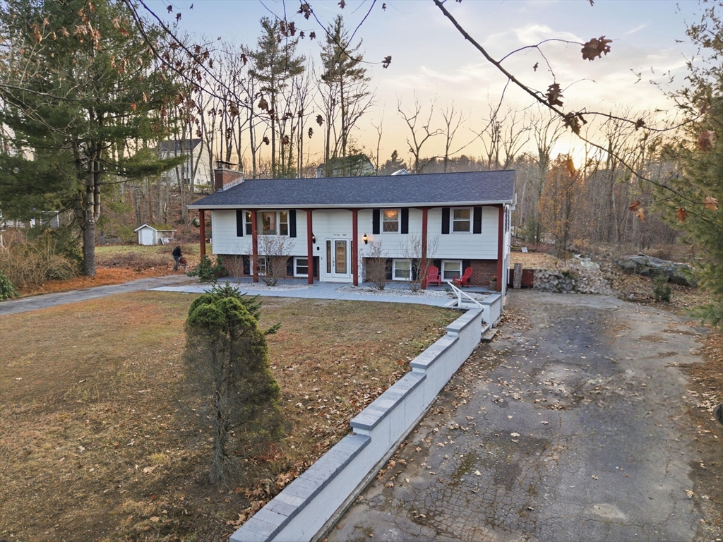 78 Dunstable Road Westford, MA 01886 - Photo 24 of 27 a view of a house with a yard