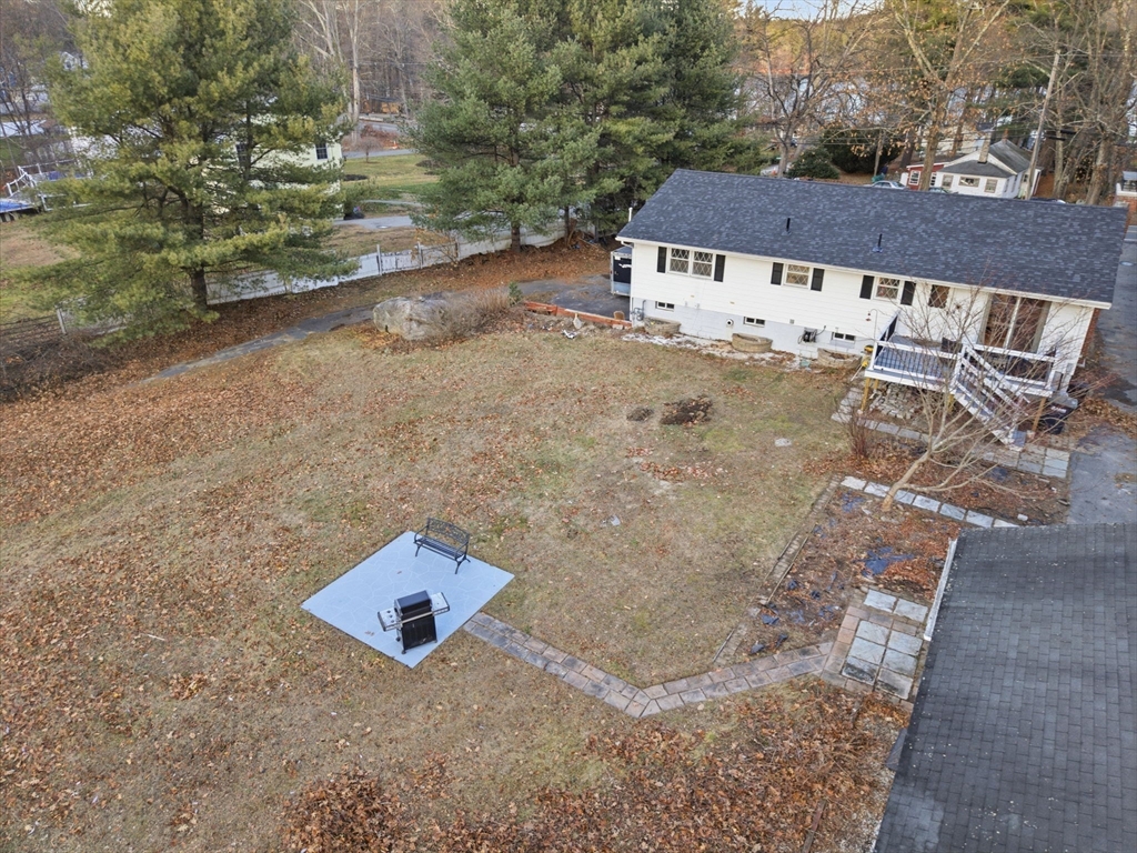78 Dunstable Road Westford, MA 01886 - Photo 25 of 27 an aerial view of a house with a yard