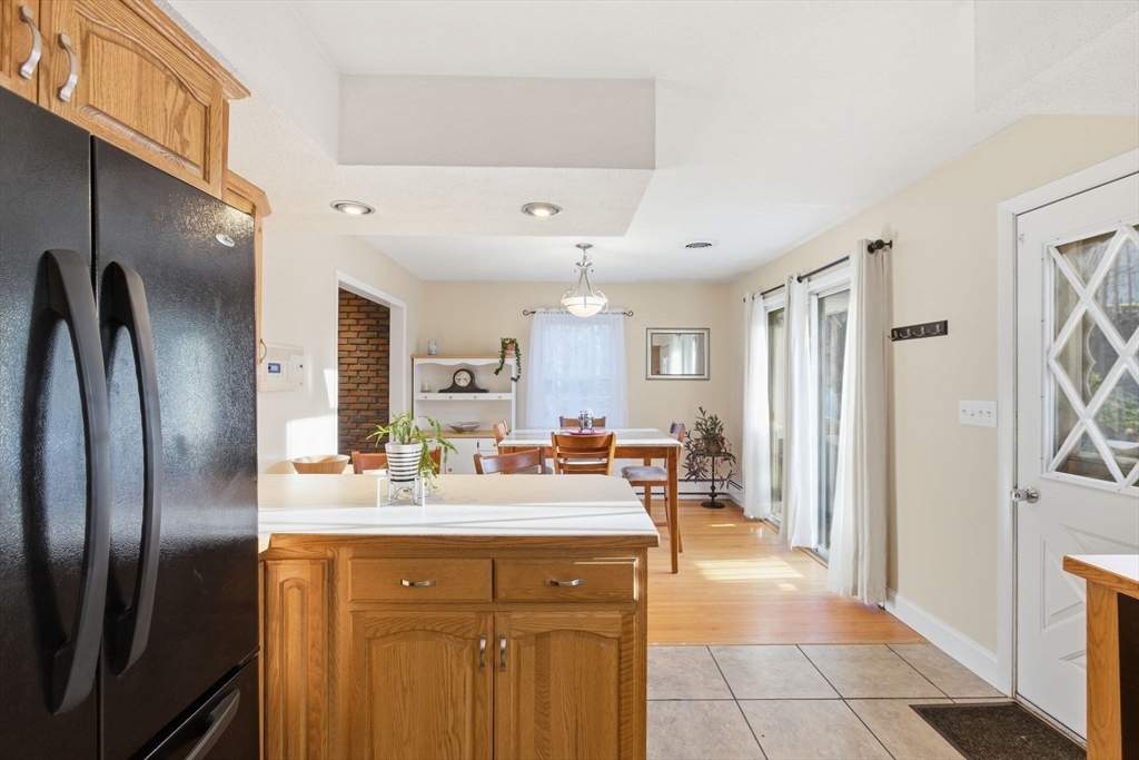 78 Dunstable Road Westford, MA 01886 - Photo 8 of 27 a kitchen with stainless steel appliances granite countertop a sink and a refrigerator