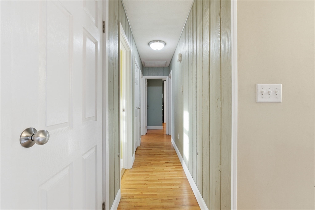 78 Dunstable Road Westford, MA 01886 - Photo 9 of 27 a view of a hallway with wooden floor