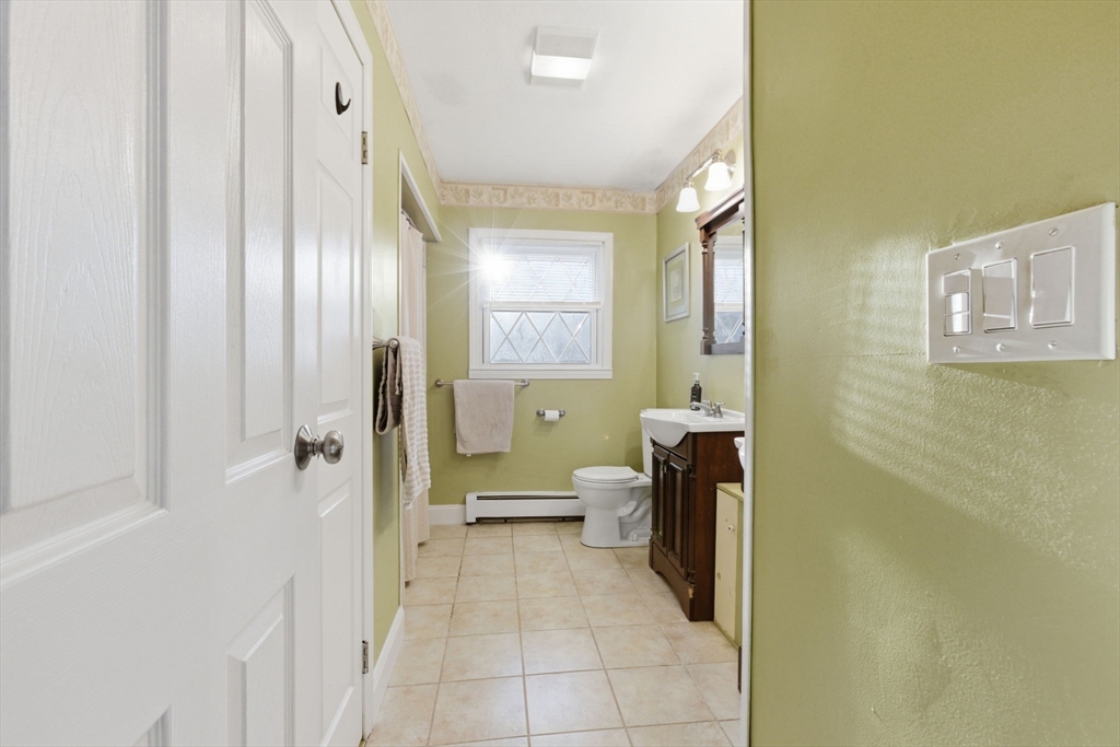 78 Dunstable Road Westford, MA 01886 - Photo 10 of 27 a bathroom with a bathtub and a toilet