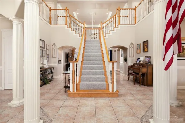 a bathroom with a granite countertop sink and a large mirror