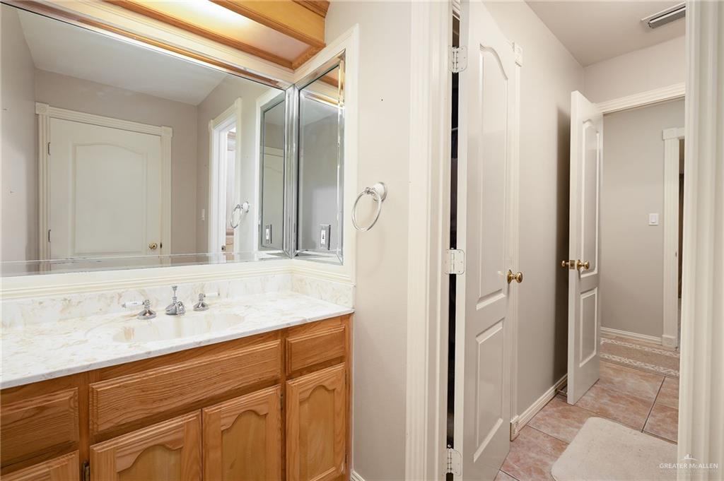23725 North Val Verde Road Edinburg, TX 78542 - Photo 30 of 38 Bathroom with vanity and light tile patterned floors