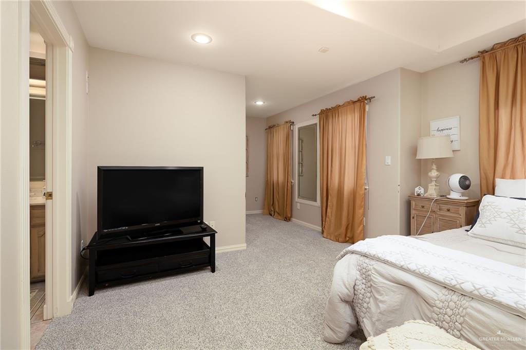 23725 North Val Verde Road Edinburg, TX 78542 - Photo 32 of 38 Bedroom featuring light colored carpet and recessed lighting