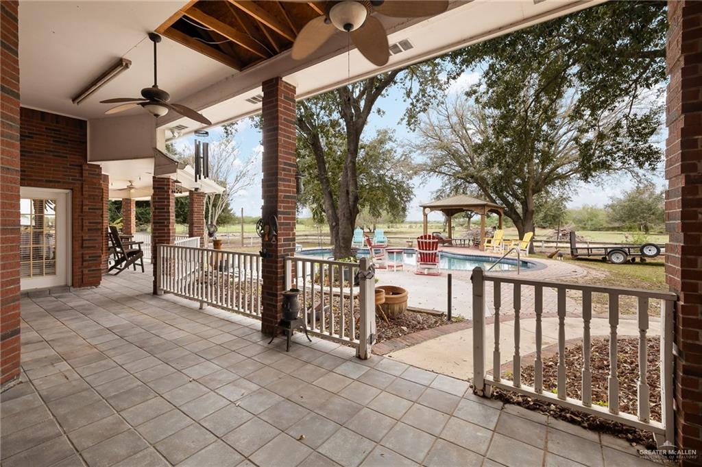 23725 North Val Verde Road Edinburg, TX 78542 - Photo 34 of 38 View of patio / terrace featuring a community pool, ceiling fan, and a gazebo