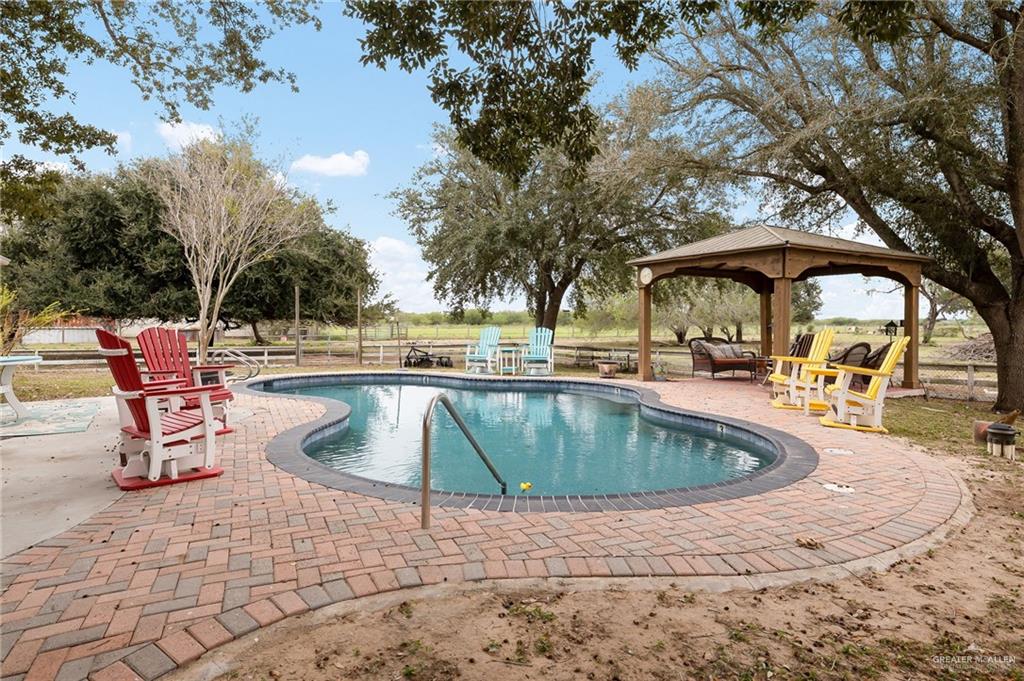 23725 North Val Verde Road Edinburg, TX 78542 - Photo 35 of 38 View of swimming pool featuring a patio area and a gazebo