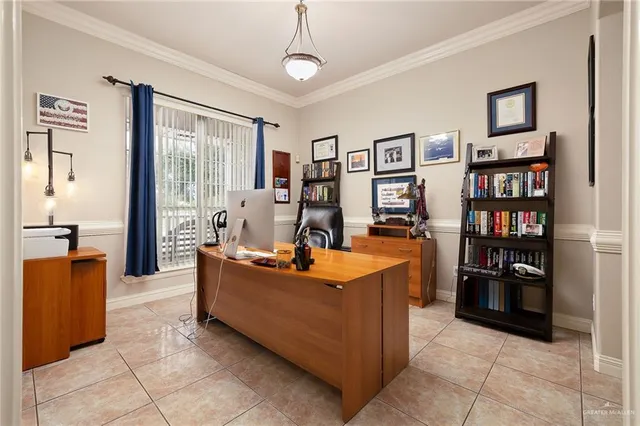 a spacious bedroom with a bed and a chandelier