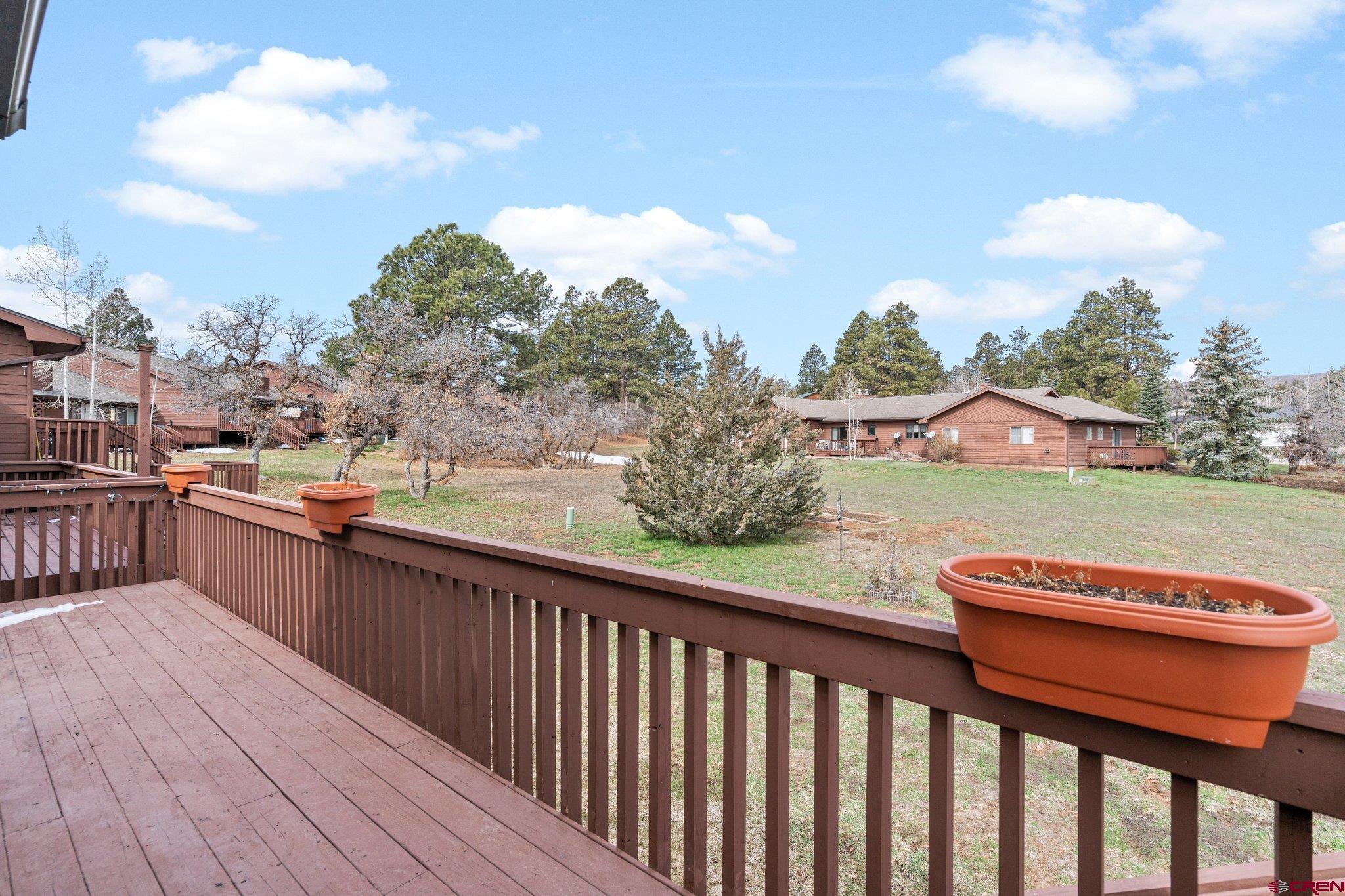 333 Pine Ridge Loop, Unit 4 Durango, CO 81301 - Photo 11 of 33 a view of a balcony with wooden floor and fence