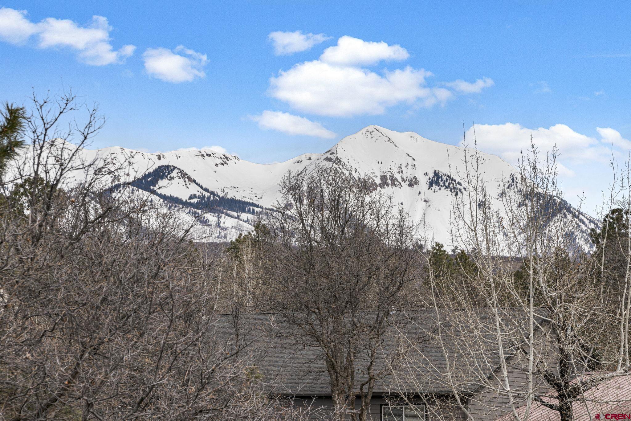 333 Pine Ridge Loop, Unit 4 Durango, CO 81301 - Photo 14 of 33 a view of a snow in the background of a house