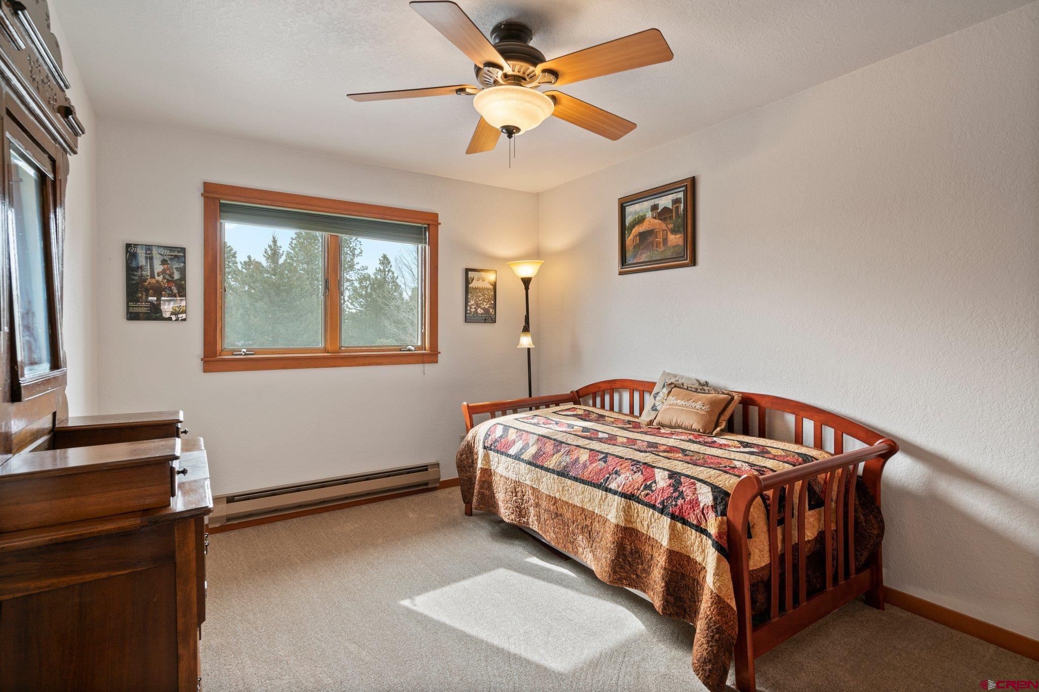 333 Pine Ridge Loop, Unit 4 Durango, CO 81301 - Photo 18 of 33 a bedroom with a bed and a window