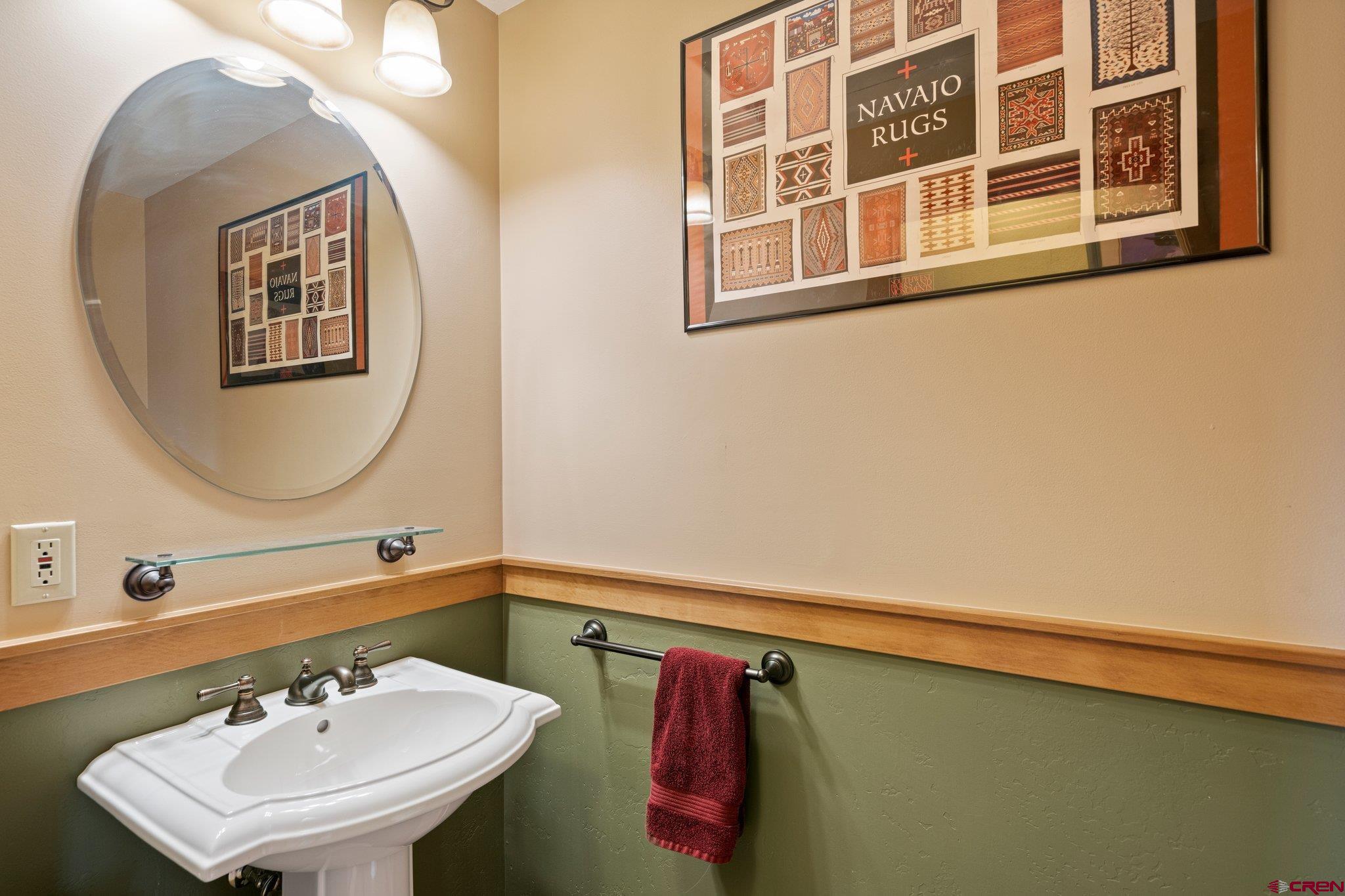 333 Pine Ridge Loop, Unit 4 Durango, CO 81301 - Photo 20 of 33 a bathroom with a sink and a mirror