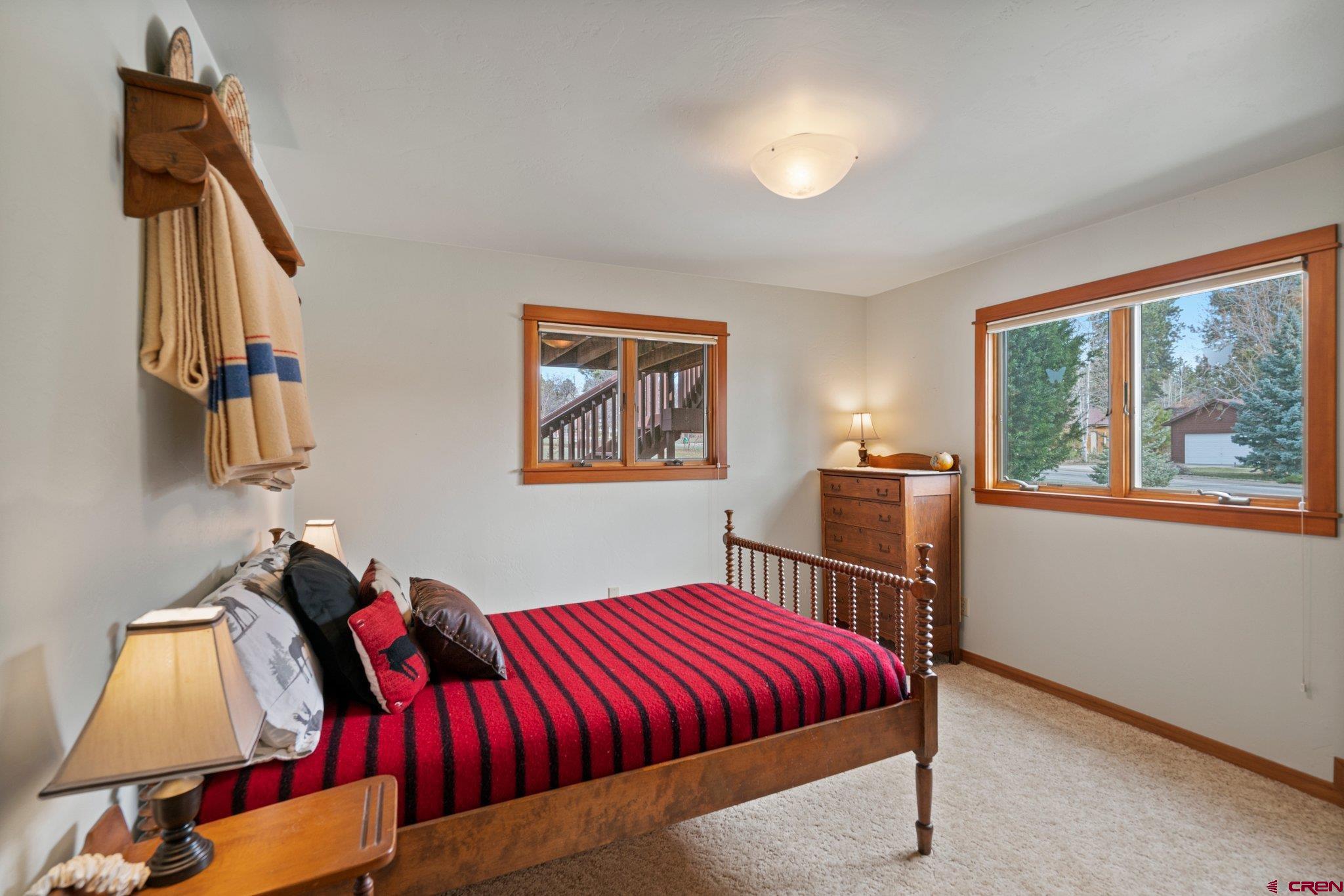333 Pine Ridge Loop, Unit 4 Durango, CO 81301 - Photo 23 of 33 a bed room with a bed and a window