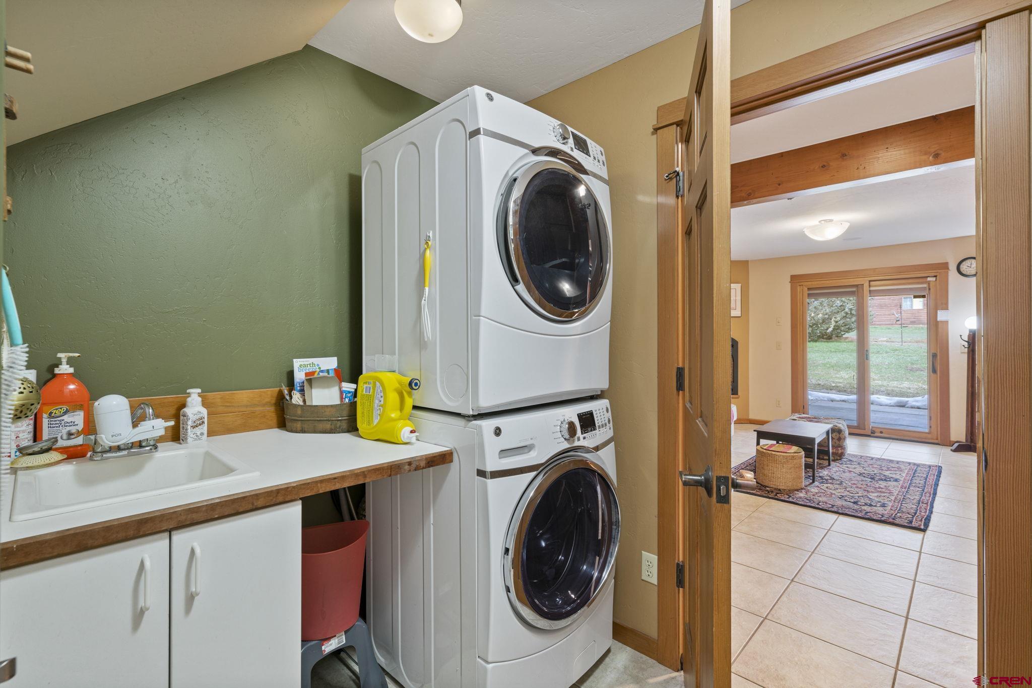 333 Pine Ridge Loop, Unit 4 Durango, CO 81301 - Photo 26 of 33 a utility room with dryer and washer