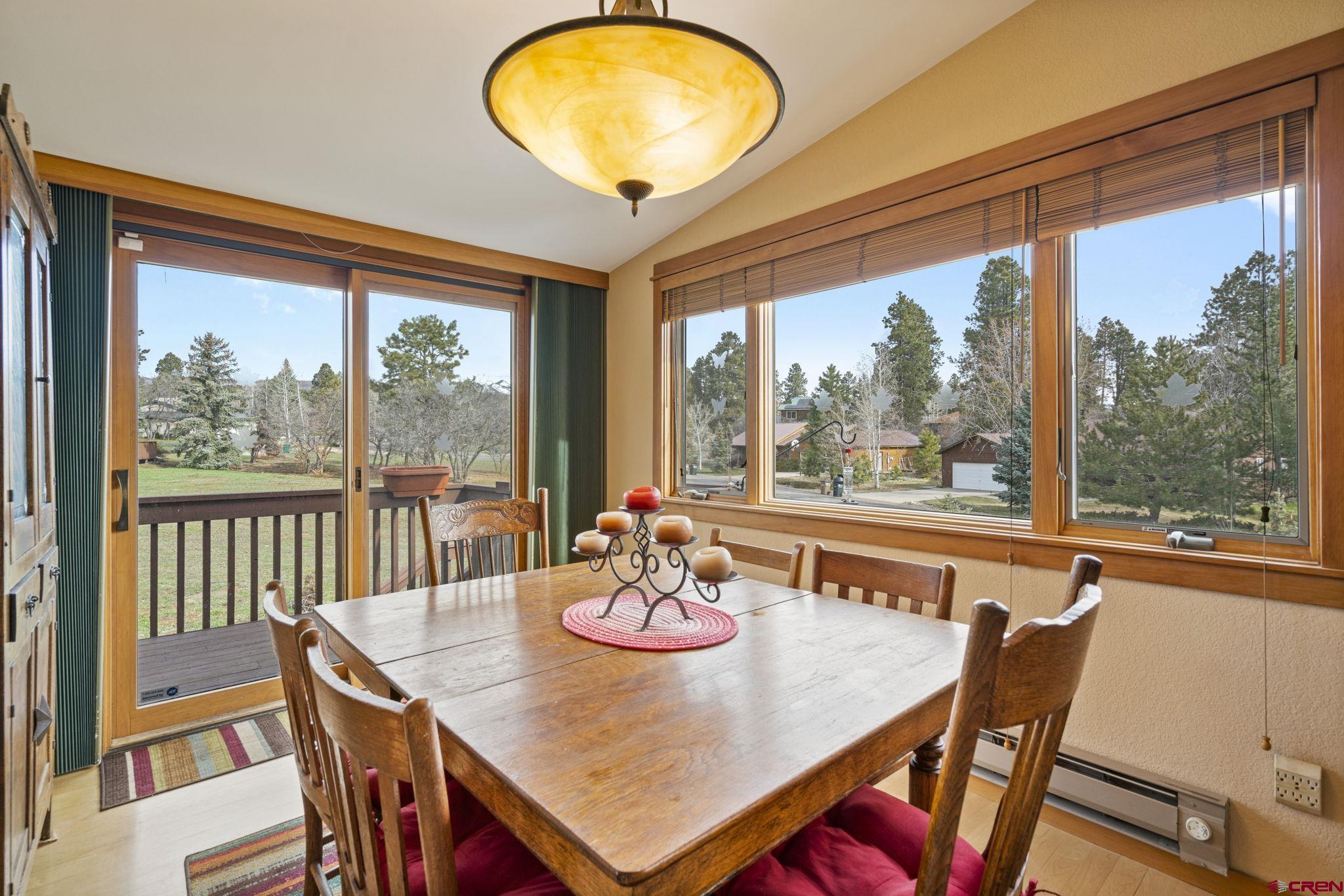 333 Pine Ridge Loop, Unit 4 Durango, CO 81301 - Photo 10 of 33 a view of a dining room with furniture window and outside view