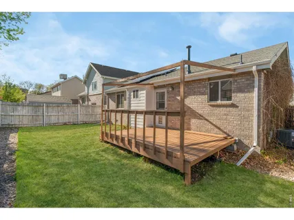 a view of balcony with a floor to ceiling window and tree