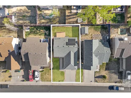 a view of a house with a backyard