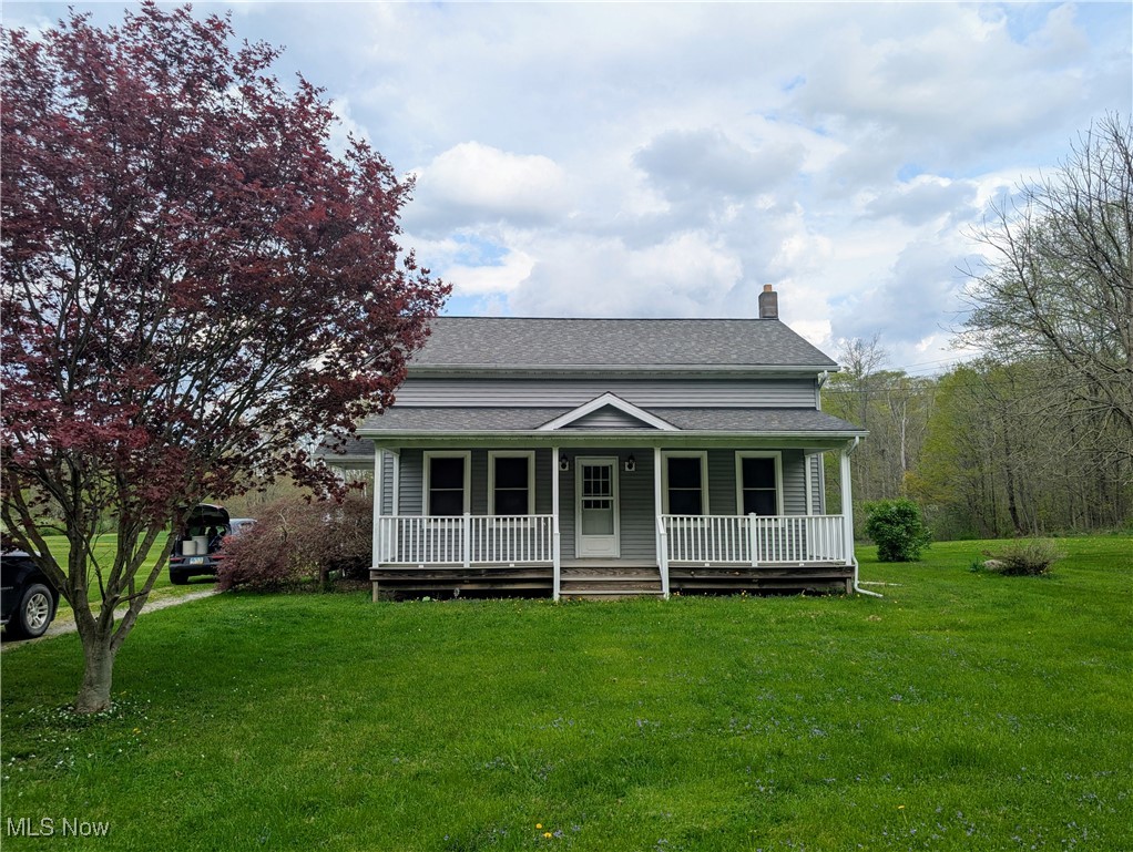 2356 Walter Main Road Geneva, OH 44041 - Photo 1 of 27 Bungalow with roof with shingles, covered porch, a chimney, and a front yard