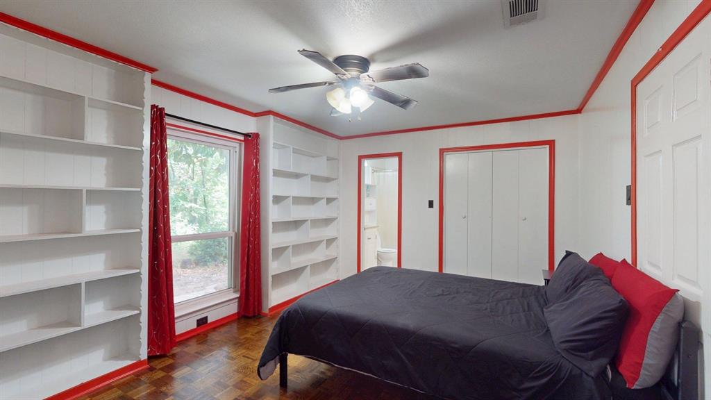 1206 South Clark Road Duncanville, TX 75137 - Photo 13 of 38 a bed room with a bed and a chandelier