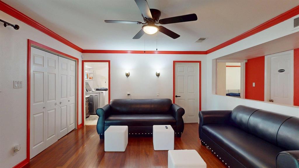 1206 South Clark Road Duncanville, TX 75137 - Photo 19 of 38 a living room with furniture and a wooden floor