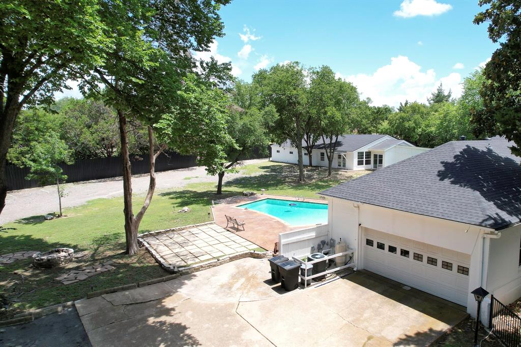 1206 South Clark Road Duncanville, TX 75137 - Photo 2 of 38 a view of a backyard with a table and chairs