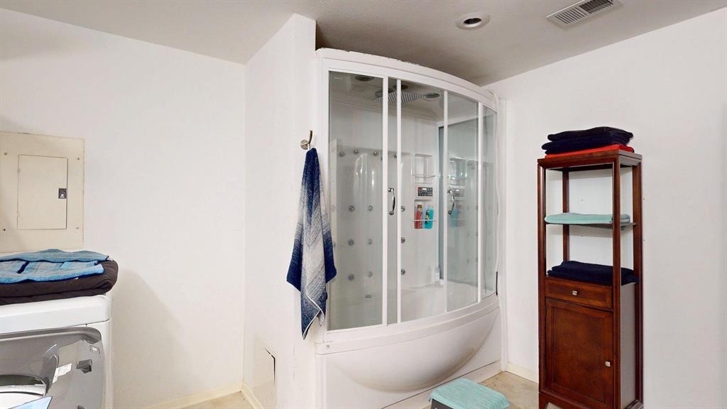 1206 South Clark Road Duncanville, TX 75137 - Photo 22 of 38 a bathroom with a toilet and a shower