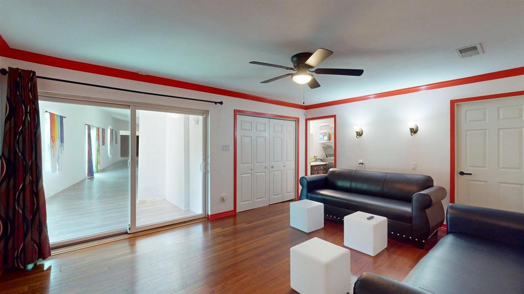 1206 South Clark Road Duncanville, TX 75137 - Photo 27 of 38 a living room with furniture and a wooden floor