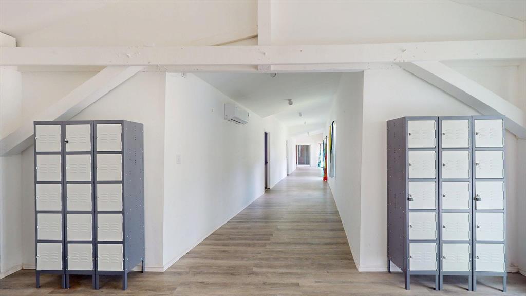 1206 South Clark Road Duncanville, TX 75137 - Photo 31 of 38 a view of a hallway with wooden floor and entryway