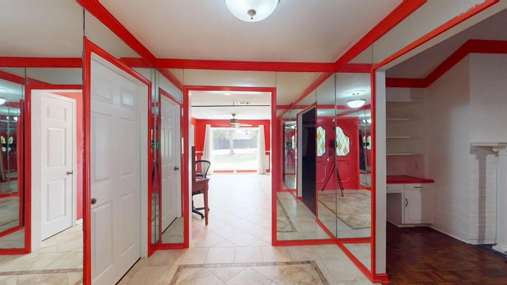 1206 South Clark Road Duncanville, TX 75137 - Photo 10 of 38 a view of a hallway with dining area and glass door